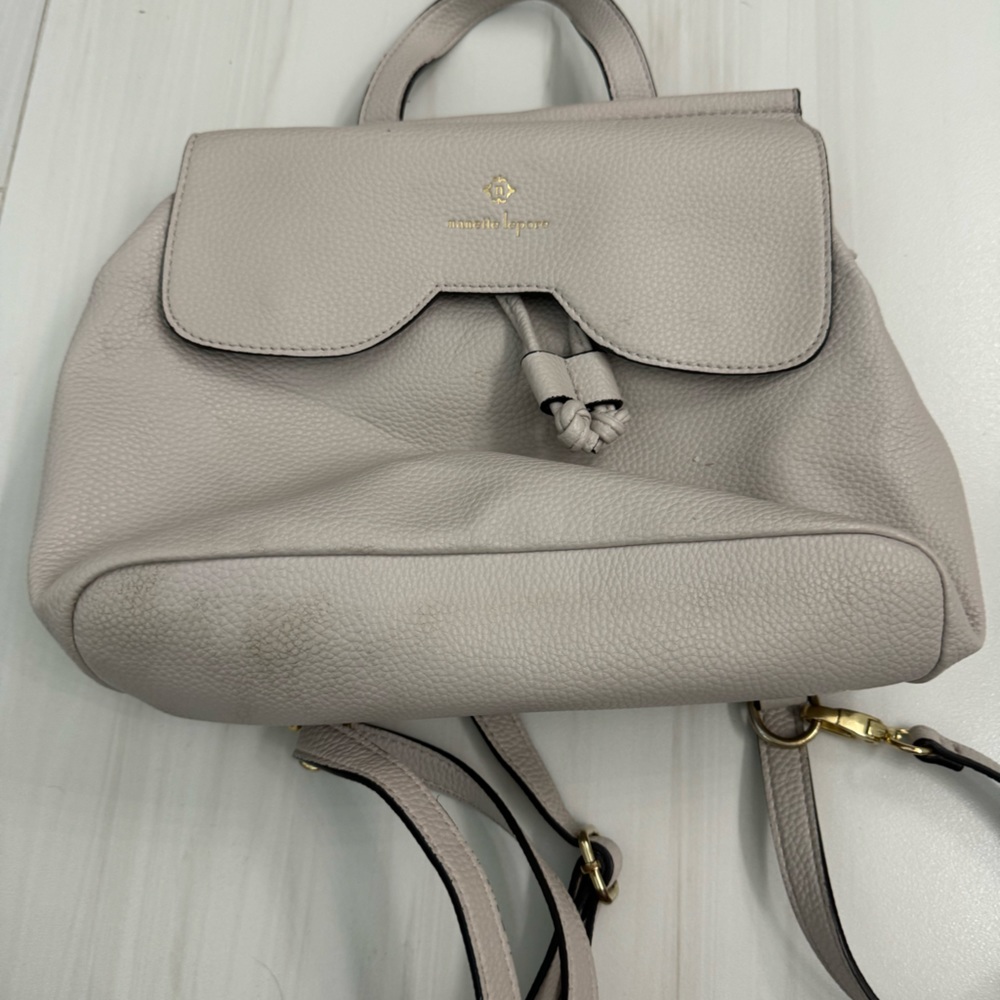 dusty pink bag that can be a purse or backpack.